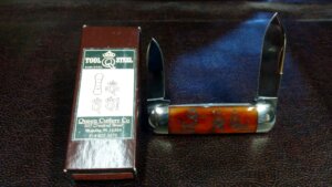 Dan Burke Baby Sunfish smooth orange bone with engraved historical tang stamps on the handle and a deep brown box with a unique label showing the same historical tang stamps, 2010, edition of 500